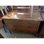 A 3' 6" Edwardian oak chest of two short and two long graduated drawers, set on square tapered
