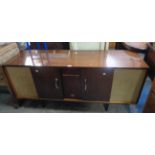 A 5' 3 1/2" polished sepele and mixed wood cased Pye stereophonic radiogram with Garrard deck Serial