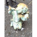A small cast iron angel playing a trumpet