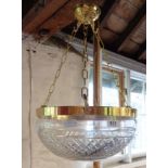 A hanging ceiling light with ornate cut glass pendant, chains and rose