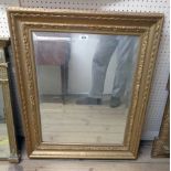 A gilt gesso framed bevelled oblong wall mirror