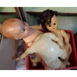 A box of vintage dolls and doll parts - various condition