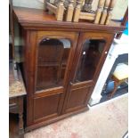 A Victorian part glazed two door book cabinet