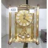 A 20th Century Acctim brass and perspex cased anniversary timepiece with quartz movement