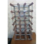 A 21 bottle modern wood and galvanised metal wine rack