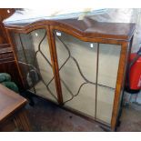 A 3' 11" 1920's walnut and glazed display cabinet with break dome top and two glass shelves enclosed