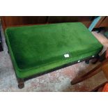 A late 19th Century mahogany framed duet foot stool with later green velour upholstery, set on short