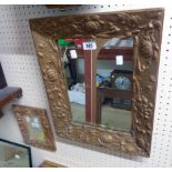 An Art Nouveau gilt framed oblong wall mirror with oblong plate and lily border - sold with a