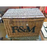 A 22" Fortnum & Mason wicker hamper - one leather closing strap missing