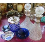 Two moulded glass decanters with plated collars, a biscuit barrel, two glass dishes, and a pottery