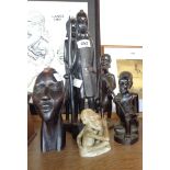 Five African carved wood figures including a pair and a bust - sold with a stone carving (damaged)