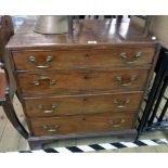 A 28" late Georgian mahogany chest of four long graduated drawers, set on bracket feet - veneer loss