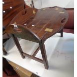 A 27 1/2" reproduction stained hardwood and brass hinged butler's tray top style coffee table, set