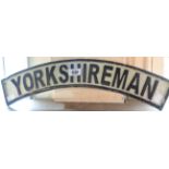 A reproduction cast iron Yorkshireman sign