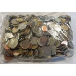 A bag containing a collection of world coinage