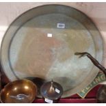 A large circular eastern brass tray with chased decoration