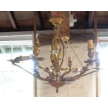 A gilt chandelier with small cherub finial