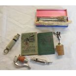A bag containing a 1915 Hudson's Metropolitan style whistle, ACME Guide whistle, vintage cyclist's
