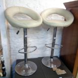 A pair of modern chrome plated and leather upholstered breakfast bar stools - a/f