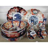 Three Imari bowls, two vases and two plates - damage