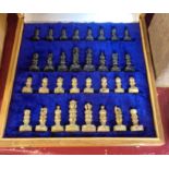 A stone chess set and wood framed integral board/case