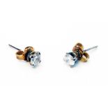 A pair of hallmarked 375 white gold diamond solitaire stud ear-rings