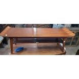 A 3' 8" vintage sapele wood two tier coffee table, set on splayed tapered supports - later varnished