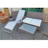 A modern patio table and two seat settee - sold with a modern folding lounger