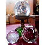 Three glass paperweights - sold with a large nativity snow globe on pedestal base