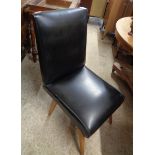 A retro black vinyl upholstered high back standard chair, set on polished wood tapered splayed legs