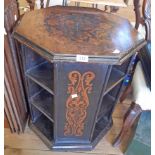 A 22 1/2" 19th Century ebonised octagonal freestanding book table with decorative stencilled foliate