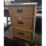 An 18 1/4" rustic made waxed pine chest of three long drawers