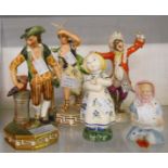 Two Royal Crown Derby figurines of Air and Earth, a 20th Century monkey band conductor figure, a