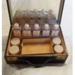 A vintage Elizabeth Arden Ardena vanity set in faux crocodile skin case