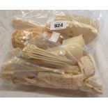 A bag of assorted carved bone collectables and other items