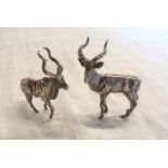 A pair of vintage South African hallmarked white metal antelope