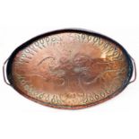 An Arts & Crafts John Pearson oval copper two handled tray with hand beaten peacock and scroll