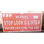 A reproduction painted cast iron Stop, Look, Listen sign