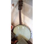 An early 20th Century Fred Cammeyer Student six string open back banjo with space for seventh