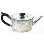 An Elkington & Co. silver teapot of oval form with engraved decoration, ebony knop and handle - base