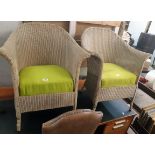 A pair of vintage Lloyd Loom tub chair with original sprayed finish and later upholstery to sprung