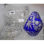 A cased and flashed blue glass Bohemian basket - sold with two cut glass bowls and a posy