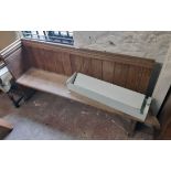 A 5' 11" Victorian stained pine church pew, set on chamfered ends - one end side panel removed and