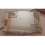 An Art Deco frameless wall mirror with shaped plate, flanking peach mirror inserts and milled edge