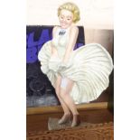 A modern reproduction painted cast iron Marilyn Monroe doorstop
