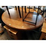 A 4' 5" Victorian mahogany pedestal loo table with oval tilt-top, set on massive turned pillar and