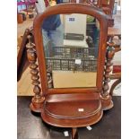 A Victorian mahogany swing dressing table mirror, set on bobbin turned supports with lift-top