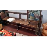 An 84 3/4" late Victorian pine platform bench with heavy Gothic style open cast iron supports to