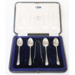 A cased part set of silver rat tail teaspoons and a pair of sugar tongs