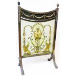 A 24" late Victorian brass framed fire screen in the Neo Classical style with ornate decoration